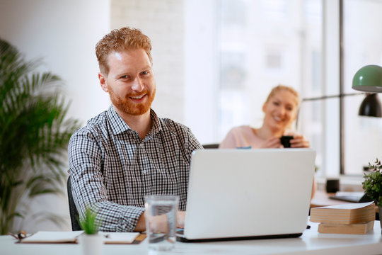 Businessman At Office Working. Attractive Red Hair Businessman. 