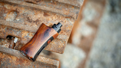 high end rebuildable dripping atomizer with stabilized natural walnut wood regulated box mods, vaping device, selective focus