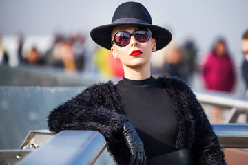 stylish woman on modern bridge