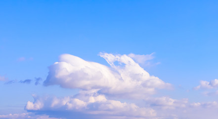 Dramatic puffy fluffy clouds isolated against blue skies