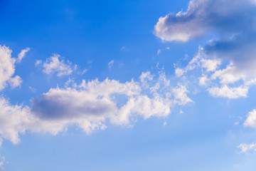Dramatic puffy fluffy clouds isolated against blue skies