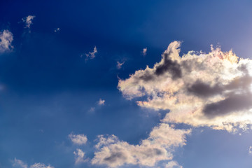 Dramatic puffy fluffy clouds isolated against blue skies