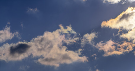 Dramatic puffy fluffy clouds isolated against blue skies