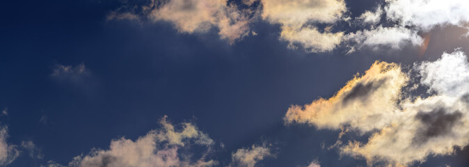 Dramatic puffy fluffy clouds isolated against blue skies