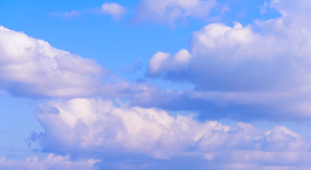 Dramatic puffy fluffy clouds isolated against blue skies