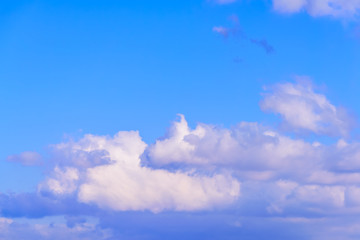 Dramatic puffy fluffy clouds isolated against blue skies