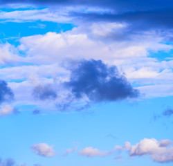 Dramatic puffy fluffy clouds isolated against blue skies
