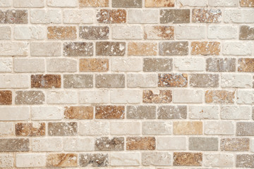 background of bricks of different shades on the wall