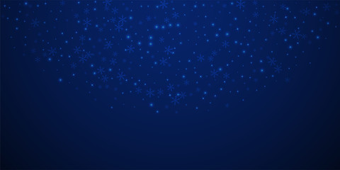 Sparse glowing snow Christmas background. Subtle f