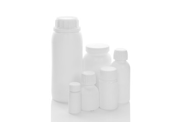 White bottles on white background.