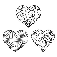 Vector illustration coloring book. Set of three hearts. Doodle style.
