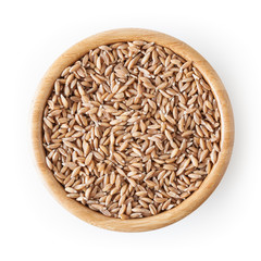 Grains of spelt in wooden bowl isolated on white background wiht clipping path