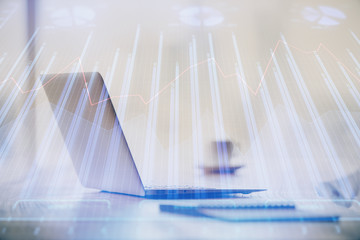 Multi exposure of chart and financial info and work space with computer background. Concept of...