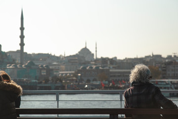 Obraz premium An elder lady travelling on city ferry and looking to Istanbul