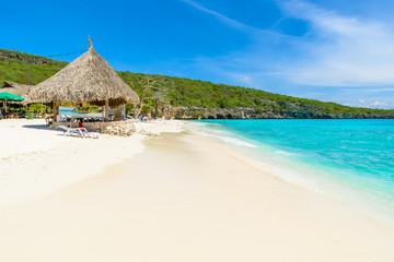 Cas Abao beach - paradise white sand Beach with blue sky and crystal clear blue water in Curacao,...