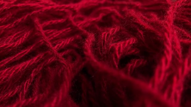 Dolly shot. Closeup. Knitted red wool background. Winter knitted clothes. Heat concepts. Cloth 4k  UHD stock footage video 