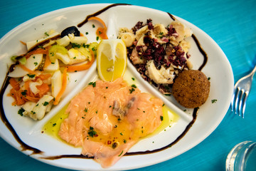 raw fish dish with octopus, mussels and salmon