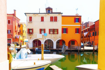 Venice, Italy. Beautiful traditional canal street with colorful houses and boats