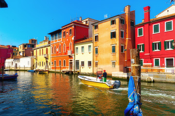 Venice, Italy. Beautiful traditional canal street with colorful houses and boats