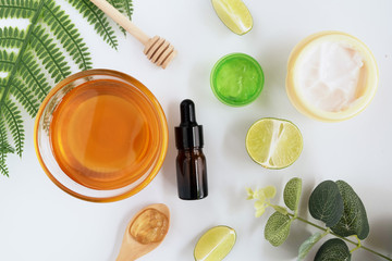 Wellness cosmetic package containers with green leaves, natural herbal ingredient. natural organic beauty product concept mock up. Blank bottle for label own branding skincare. isolated white backgrou