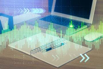 Multi exposure of graph and financial info and work space with computer background. Concept of international online trading.