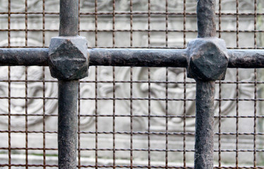ancient metal lattice on the fence of the fortress