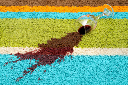 Spill of red wine over the carpet