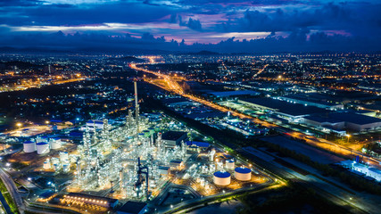 refinery zone at night and lighting cityscape with blue sky background