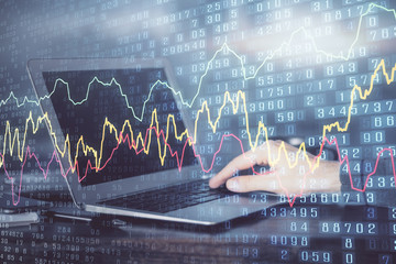 Multi exposure of market chart with man working on computer on background. Concept of financial analysis.