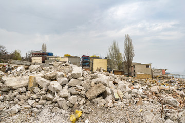 Demolished illegal buildings. Concrete dust. Developing the district. Illegal buildings on the...