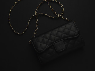 Black leather bag with golden chain