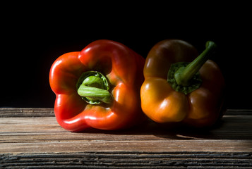 red peppers on black background