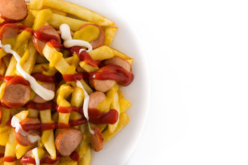 Typical Latin America Salchipapa. Sausages with fries, ketchup, mustard and mayo isolated on white background. Top view. Copy space