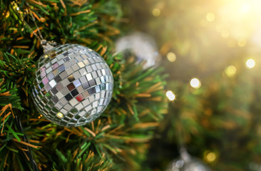Blurry of Christmas and New Year's balls with beautiful decorations on the Christmas tree, soft light, beautiful background images and illustrations.