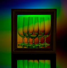 Glasses in the interior. Multi-colored backlight. Wooden frame.