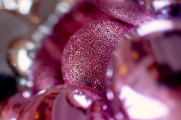 Pink Christmas balls. With blurry boke. Christmas decorations. Festive winter background. New Year. Macro photography