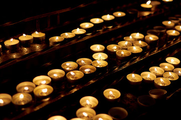 Burning candles in a church close-up	