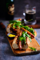 Cumberland sausage hot dogs with beery onions..style rustic