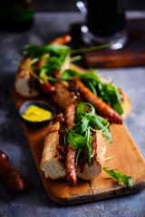 Cumberland sausage hot dogs with beery onions..style rustic