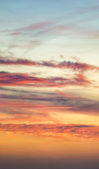 Fantastic clouds at sunrise, vertical panorama