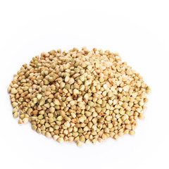 Heap of dried buckwheat seeds isolated on white background.