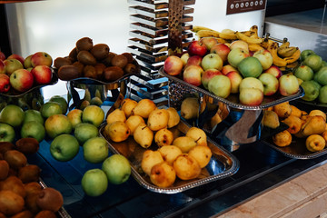 plates with fresh fruit oranges apples pineapple bananas healthy