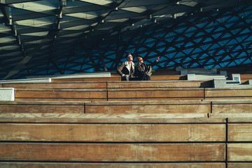 Couple chilling on open tribune