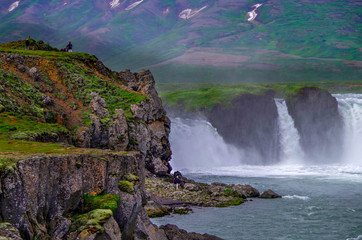 Breathtaking view of impressive power and magic of powerful Iceland Godafoss Waterfall Cascade with...