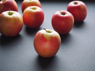 red apples on black background