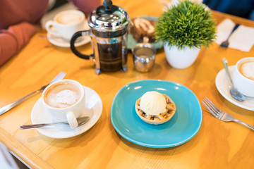 Drink And Dessert On Table In Cafe