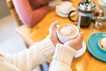 Woman Enjoying Coffee At Cafe