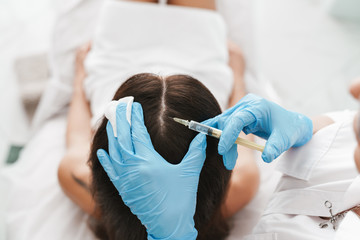 Naklejka premium Photo of women getting mesotherapy treatment in head