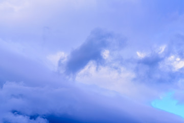 Dramatic puffy clouds isolated against blue skies