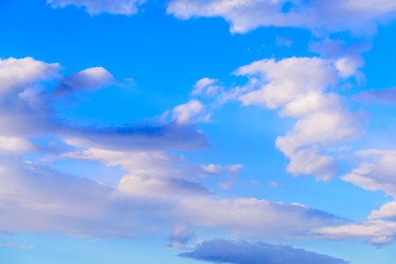 Dramatic puffy clouds isolated against blue skies